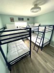 Two sets of bunk beds in the guest bedroom